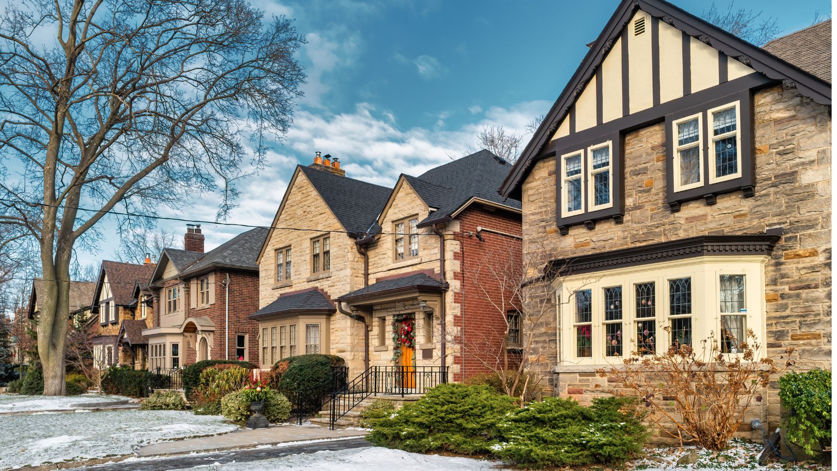 Row of bright brick houses under a clear sky