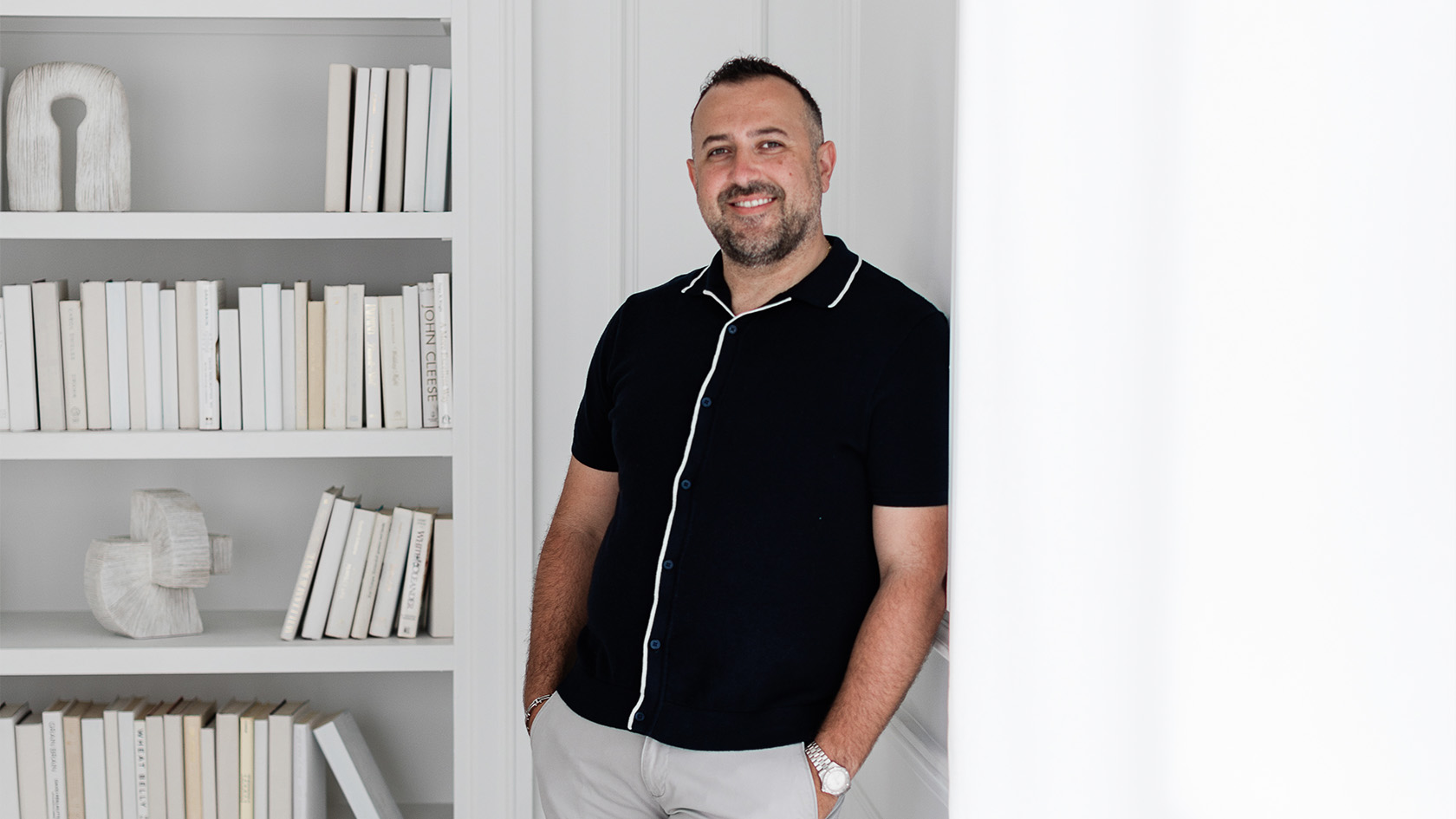 Joseph Nicosia, a Toronto real estate agent against a white wall